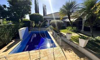 Imagem 2: Casa térrea à venda no condomínio Alphaville Campinas, sala ampla para 3 ambientes, lavabo