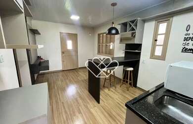 Imagem 4: Casa com 2 Dormitórios, Área de Lazer com Churrasqueira e Lareira: Conforto e Estilo para