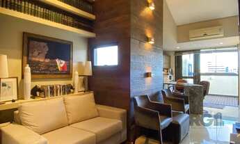 Imagem: Sala mobiliada, com churrasqueira para happy