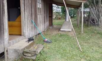 Imagem 5: Terreno com casa de madeira