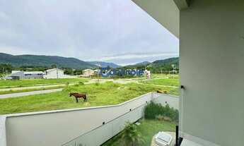 Imagem 5: Casa com 4 dormitorios sendo 01 suíte e vaga de garagem para 03 carros em Forquilhas - São