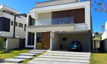 Imagem 3: Sobrado 5 quartos sendo 4 suites com piscina, cozinha integrada e sala 2 ambientes, 4 vaga