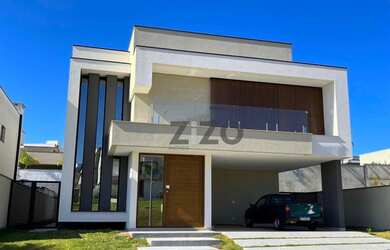 Imagem 2: Sobrado 5 quartos sendo 4 suites com piscina, cozinha integrada e sala 2 ambientes, 4 vaga