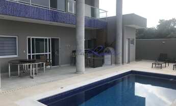 Imagem 6: Casa de condomínio para venda tem 380 metros quadrados com 5 suítes