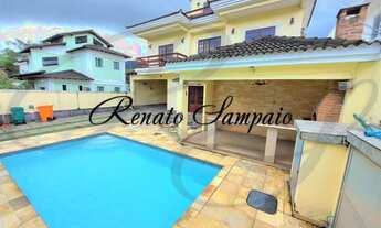 Imagem 4: Casa triplex em condomínio, com 4 suítes, sótão, piscina, sauna a vapor e vaga para 4 carr