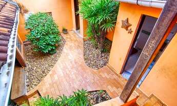 Imagem 7: Casa rústica com piscina numa área verde em Pipa