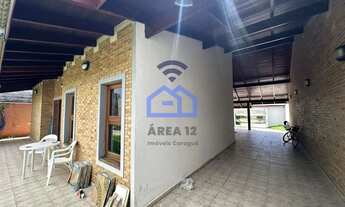 Imagem 4: Casa à venda com 3 dormitórios a apenas 100 metros da praia do Indaiá um dos bairros mais