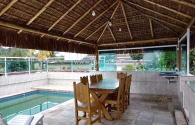 Imagem 5: Casa térrea na Praia de Pernambuco com piscina e churrasqueira