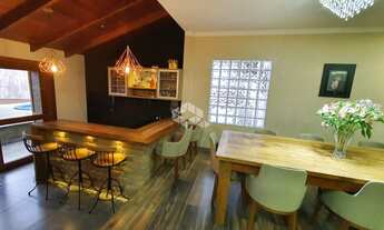 Imagem 3: Térrea para venda possui 200 metros quadrados com 4 quartos em Igara - Canoas - RS