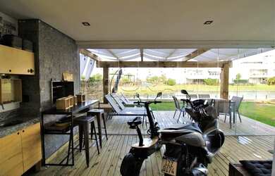 Imagem 6: Apartamento térreo, localizado em um dos condomínios mais belos da praia de Atlântida