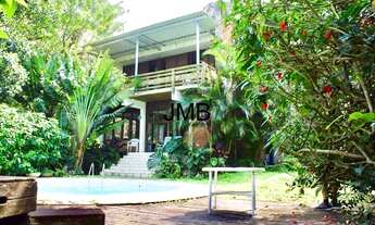 Imagem: Casa paradisíaca localizada em um condomínio