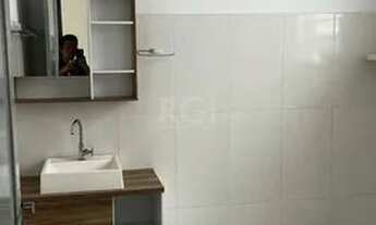 Imagem 6: Apartamento de dois dormitórios, banheiro e sala no bairro da Azenha em Porto Alegre