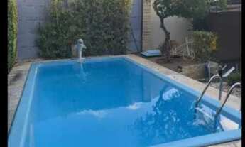 Imagem 2: Casa Padrão de 2/4 com 1 suíte de 110 m², terreno de 300 m², piscina, 4 vagas por 590.000