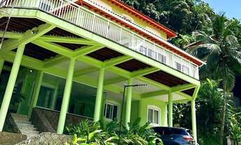 Imagem: Casa verde Pé na areia