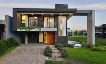 Imagem: Casa de esquina decorada beira lago, piscina