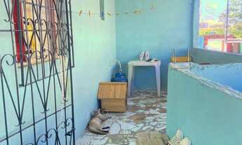 Imagem 13: Casa aconchegante com varanda e quintal