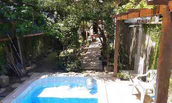 Imagem 5: Lindíssima casa dúplex, com uma belíssima área privativa com piscina e um paisagismo lind