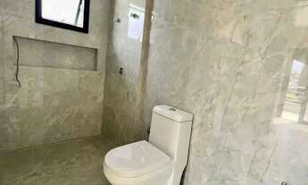 Imagem 3: Casa de alto padrão com 4 dormitórios sendo 3 suítes e 4 vagas de garagem em Camboriú/SC