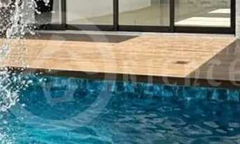 Imagem 4: Casa de alto padrão para venda, fachada moderna, 3 suítes sendo uma master com closet