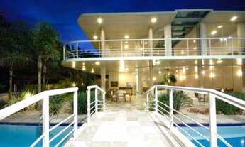 Imagem: Casa cinematográfica, pé na areia na Praia