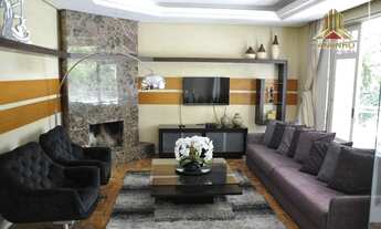 Imagem 2: Fácil acesso ao Colegio Farroupilha, casa de quatro suítes e quatro vagas de garagem, no c