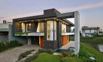 Imagem 3: Casa de esquina decorada beira lago, piscina e 05 suítes à venda - Condomínio Capão Ilhas