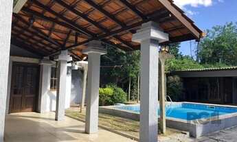 Imagem 2: Casa de 365m² - 4 dormitórios sendo 3 suítes e 5 vagas de garagem no bairro Partenon