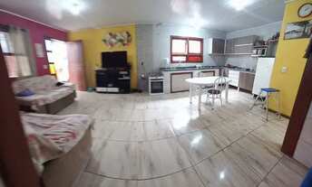 Imagem: Casa com prédio comercial