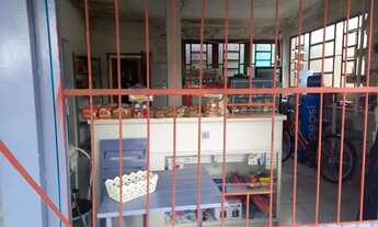 Imagem 3: Casa com prédio comercial