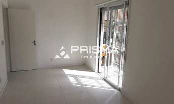 Imagem 6: 2 dormitórios + dependência, sacada e garagem no centro