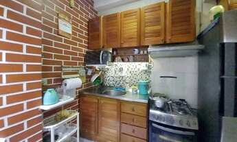 Imagem 4: Apartamento de sala quarto, claro e arejado com cozinha integrada e área de serviço na Gló