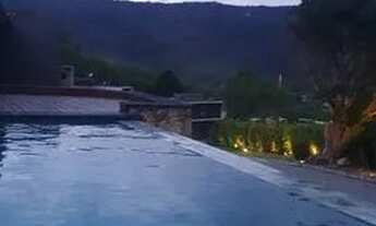 Imagem 3: Casa de condomínio para venda tem 311 metros quadrados com 3 quartos e piscina borda infin