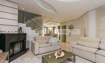 Imagem 3: Sobrado para venda possui 250 metros quadrados com 4 quartos em Mário Quintana - Porto Ale