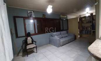 Imagem 4: Casa 2 pavimentos (estilo sobrado), com 2 dormitórios e 2 vagas, no bairro Partenon, em Po