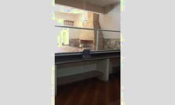 Imagem 3: Salão com churrasqueira pia e balcão