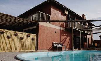 Imagem: Casa com Piscina e pé na areia em passo