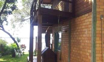 Imagem 2: Casa para venda possui 695 metros quadrados com 1 quarto em Lagoa da Conceição - Florianóp