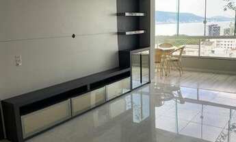 Imagem 5: Apto de frente semi mobiliado, com sala de jantar completa, painel para TV, sacada fechada