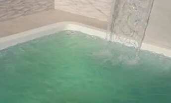 Imagem 2: Casa com piscina e suites