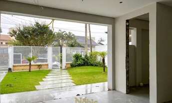 Imagem 3: Casa com amplo espaço interno e de laser com 4 dormitórios e uma casa anexa no mesmo pátio