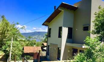 Imagem 3: Casa para venda Ferrugem tem 98 metros quadrados com 2 suítes, lareira, vista lagoaSC