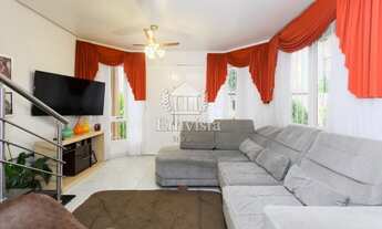 Imagem 4: Casa em estilo sobrado, com 3 dormitórios, no Bairro Harmonia, em Canoas