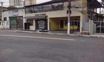 Imagem: Predio comercial e sobrado residencial e