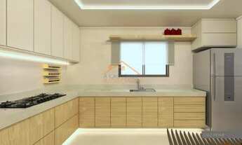 Imagem 2: Apartamento de aproximadamente 90m² total com três quartos, sala ampla, 2 vagas de garagem