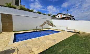 Imagem 4: Linda casa a venda no Ninho Verde 1, com 3 dormitórios, piscina, frente com área de preser
