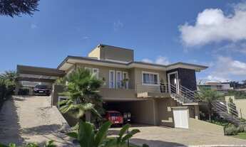 Imagem 3: Casa de condomínio térrea para venda possui 450 metros quadrados com 5 quartos