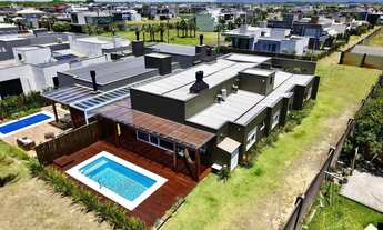 Imagem 4: Casa mobiliada com piscina e 4 suítes à venda - Condomínio Riviera - Xangri-Lá/RS REF