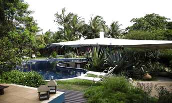 Imagem: Pousada com paisagismo exuberante e área