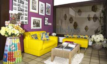 Imagem 7: Pousada com paisagismo exuberante e área de lazer com piscina