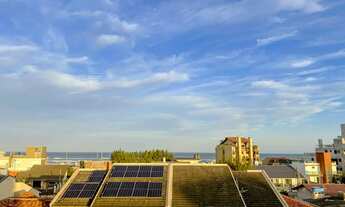 Imagem: Vista para o mar na sala e pôr do sol nos